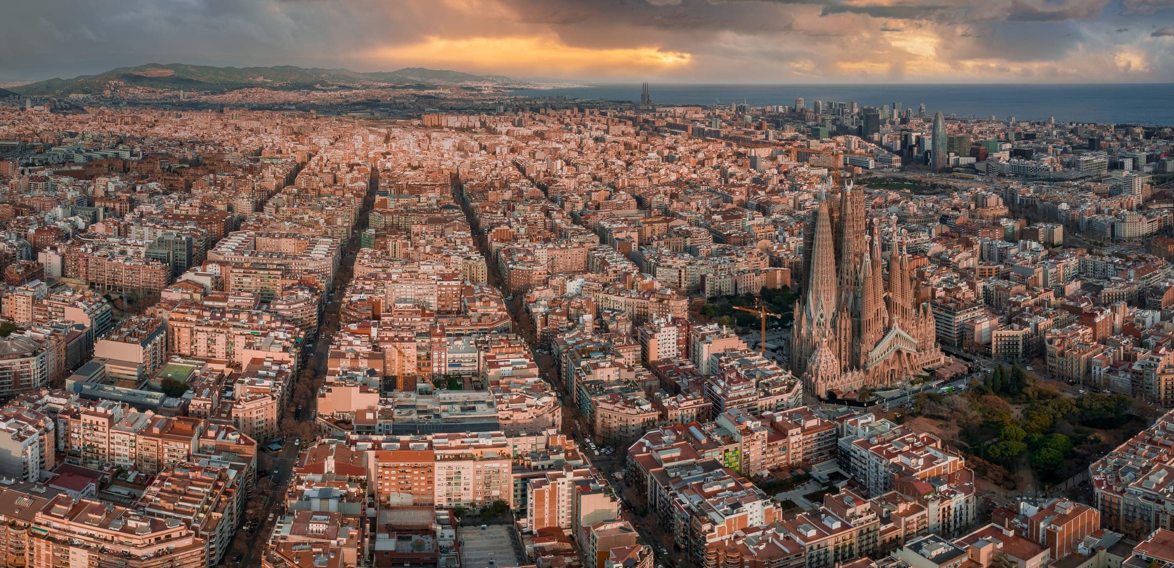 Aerial view of the Barcelona skyline and Sagrada Família at dusk